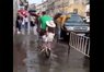 Львів'янин велосипедом перевозить людей через калюжу. Відео дня