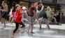 Десятки дітей рятуються від спеки у сухому фонтані у центрі Львова. Фото дня