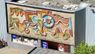 На фасаді львівського супермаркету відкрили заховану понад десять років тому мозаїку