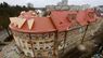 У Львові повністю відновили дах зруйнованого російською ракетою будинку. Фото до і після