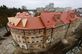 У Львові повністю відновили дах зруйнованого російською ракетою будинку. Фото до і після